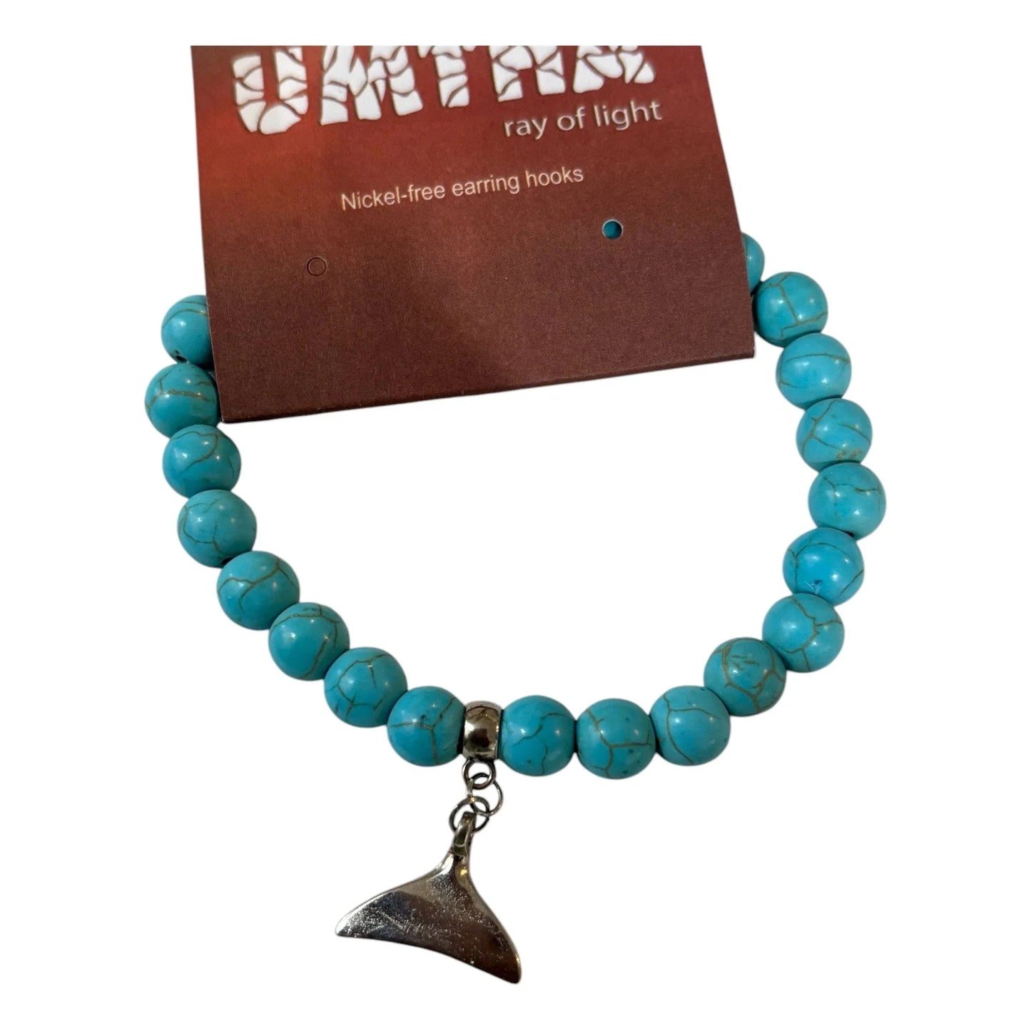 Whale tail on howite stones - Kashae Wings of Hope