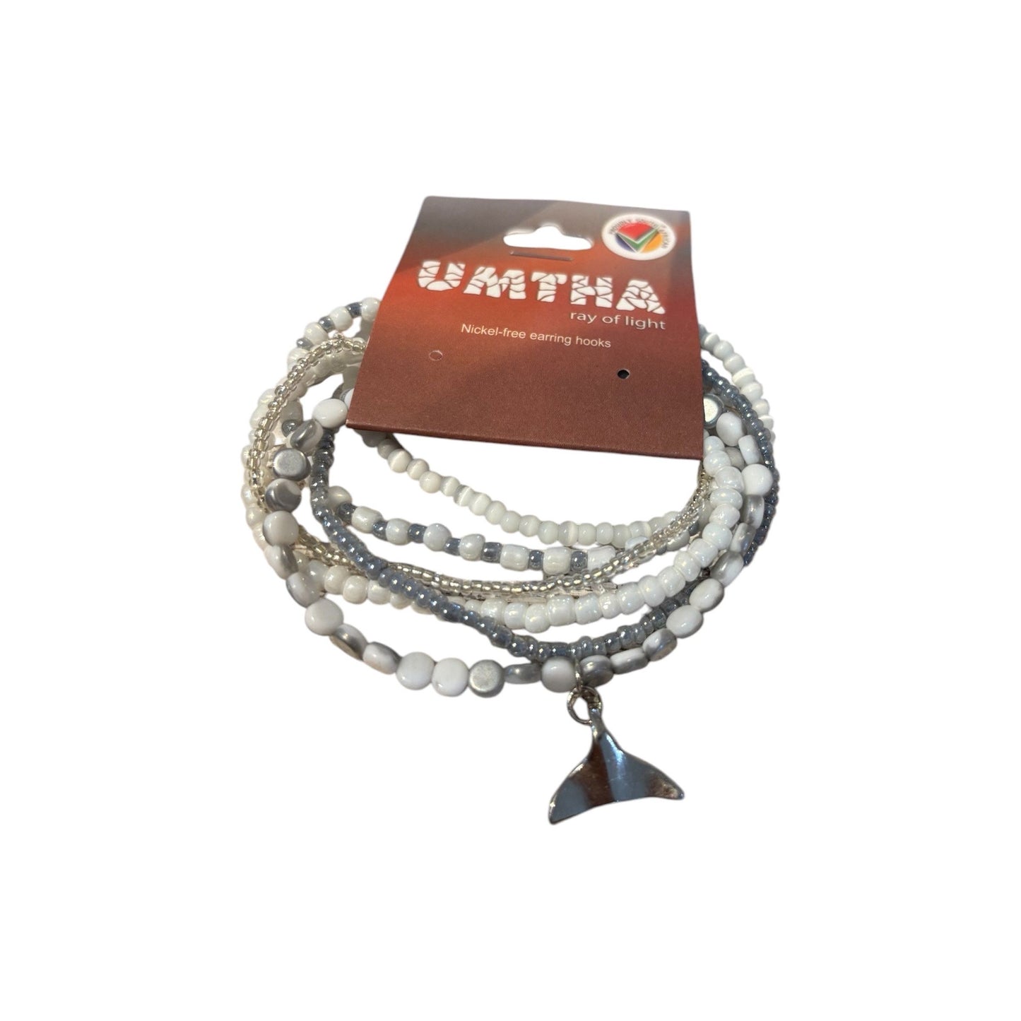 A multi-strand beaded bracelet with a stainless steel whale tail charm