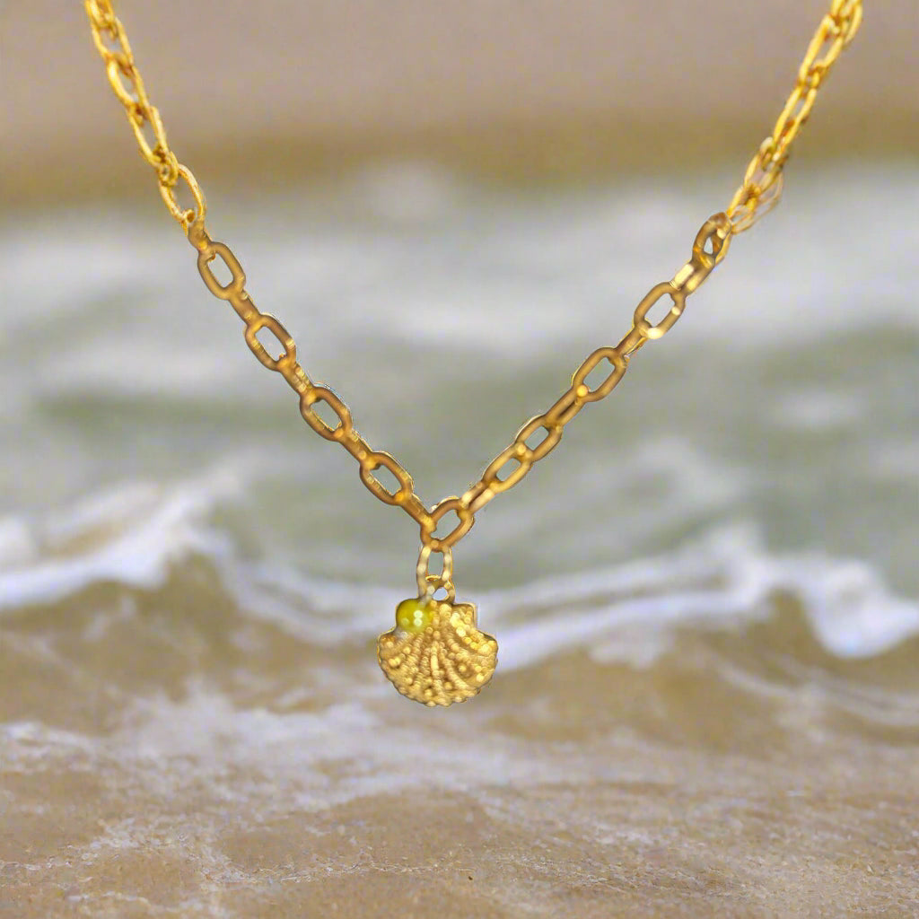 A gold-colored stainless steel waterproof anklet with a shell-like design.