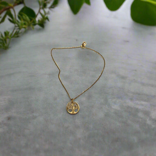 A waterproof gold-stainless steel anklet with a tree of life design.