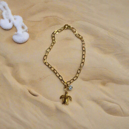 A gold-colored stainless steel waterproof carpet bracelet with a turtle-shaped charm.